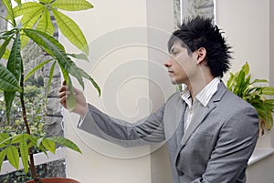 Stock photo of young businessman thinking about green issues