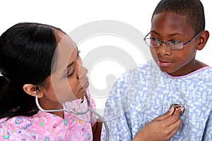 Stock Photography: Nurse Checking Listening to Boy's Chest with