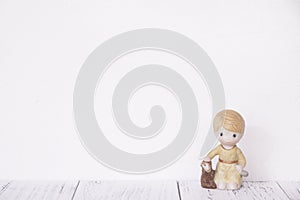 Stock photography retro white wall wooden vintage paint floor and ceramic doll toy boy sheep
