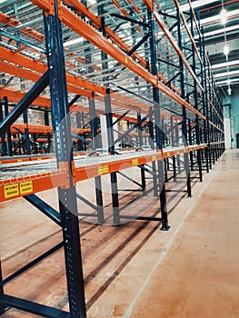 Stock is ready in preparation,Row of shelves with storage boxes in modern warehouse store at factory warehouse storage