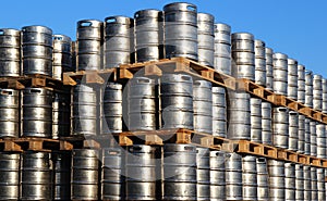 Stock of steel kegs of beer in factory yard