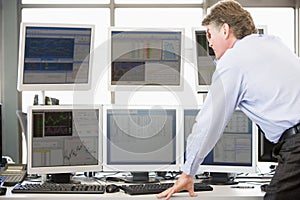 Stock Trader Examining Computer Monitors