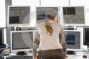 Stock Trader Examining Computer Monitors