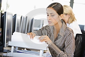 Stock Trader Going Through Paperwork