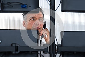 Stock Trader Looking At Multiple Computer Screens