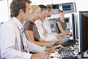 Stock Traders Working At Computers