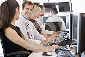 Stock Traders Working At Computers