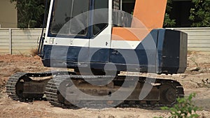 Stock Video Footage 1920x1080 Excavator on a construction site equates land clearing a building site, excavator bucket working.