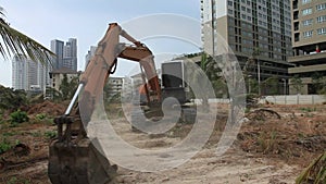 Stock Video Footage 1920x1080 Sound. Excavator on a construction site equates land clearing a building site, excavator bucket work