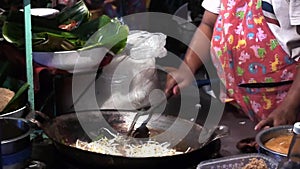 Stock Video Footage hdv Cooking Thai food outdoors, fried boiling oil, pies
