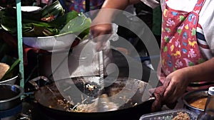 Stock Video Footage hdv Cooking Thai food outdoors, fried boiling oil, pies