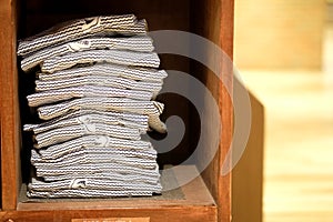 Stock of yukata on wood shelf