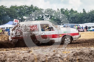 Stockcar drives on a dirty track at a Stockcar challenge.