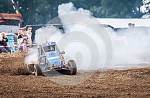 Stockcar drives on a dirty track at a Stockcar challenge.