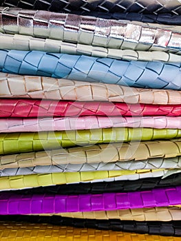 Stocked colorful leather materials close up