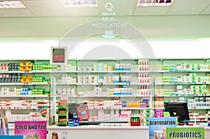 Stocked with trusted brands. shelves stocked with various medicinal products in a pharmacy.