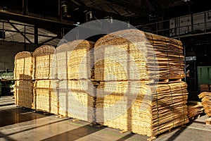 Stocked wooden veneer for plywood and furniture production in industrial plant shop