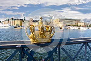 Stockholm old town Gamla Stan cityscape and Royal crown, Sweden