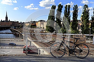 Stockholm, Sweden - Chained bike with the old town quarter Gamla