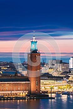 Stockholm, Sweden. Famous Tower Of Stockholm City Hall. Popular Destination Scenic In Sunset Twilight Dusk Lights