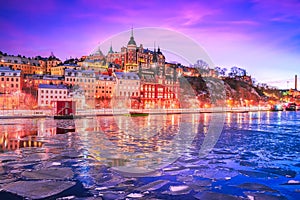 Stockholm, Sweden. Night scenic Mariaberget downtown and frozen Lake Malaren