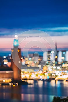 Stockholm, Sweden. Night Skyline Abstract Boke Bokeh Background. Design Backdrop. Tower Of Stockholm City Hall