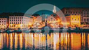 Stockholm, Sweden. Scenic Famous View Of Embankment In Old Town Of Stockholm In Night Lights. Great Church Or Church Of