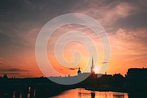 Stockholm, Sweden. Sunset Sun Shine Through Dark Silhouette Of Riddarholm Church In Stockholm Skyline. Scenic View Of