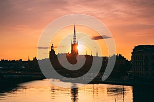 Stockholm, Sweden. Sunset Sun Shine Through Dark Silhouette Of Riddarholm Church In Stockholm Skyline. Scenic View Of