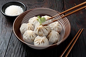 StockImage Traditional Korean Mandu dumplings presented elegantly with chopsticks