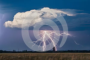 StockPhoto Lightning bolt strikes large cloud dramatically in expansive sky