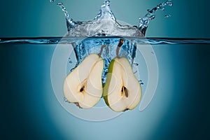 StockPhoto Water splash featuring sliced pears in an isolated setting