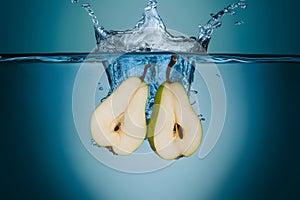 StockPhoto Water splash featuring sliced pears in an isolated setting photo