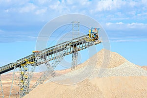 Stockpile and conveyor belt in a copper mine photo