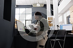 Stockroom employee checking merchandise logistics