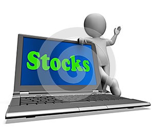 Stocks Laptop Shows Shares Dow And Stock Market photo
