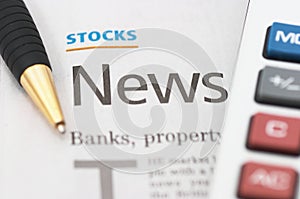 Stocks News, pen, calculator, banks, property headlines