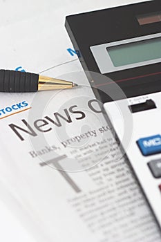 Stocks News, pen, calculator, banks, property headlines