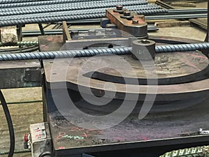 Stocks of round pipe steels and prepared round pipe steel on the bending machine.