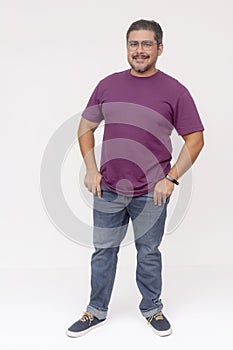 A stocky middle aged man wearing glasses.. Full body photo, wearing purple waffle shirt and jeans, isolated on a white background