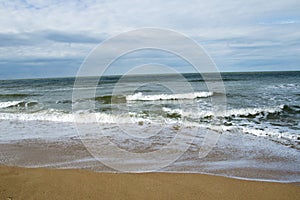 Stoem at the sea wave and cloudy sky