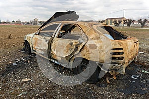 Stolen, abandoned, and burned out car.