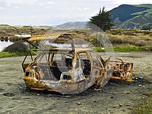 Stolen burnt-out rusty car