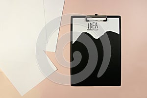 Stolen idea. clipboard top view on table on on colored background word idea marker conceptual photo top view