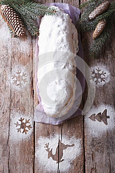 Stollen Christmas cake on the table. vertical top view