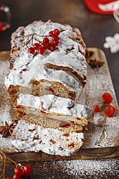 Stollen is fruit bread of nuts, spices, dried or candied fruit, coated with powdered sugar. It is traditional German bread eaten