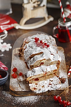 Stollen is fruit bread of nuts, spices, dried or candied fruit, coated with powdered sugar. It is traditional German bread eaten