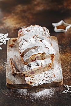 Stollen is fruit bread of nuts, spices, dried or candied fruit, coated with powdered sugar. It is traditional German bread eaten