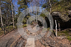 Stolowe Mountains National Park. Path in Rock Labyrinth hiking trail Bledne Skaly. Errant Rocks in Sudetes Mountains near Kudowa-