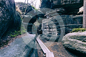 Stolowe Mountains National Park. Path in Rock Labyrinth hiking trail Bledne Skaly. Errant Rocks in Sudetes Mountains near Kudowa-